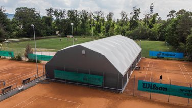 Gable view of a tennis hall with thermal roof cover