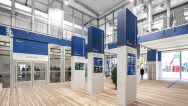 Interior view of the exhibition hall with lobby and multimedia presentation monitors