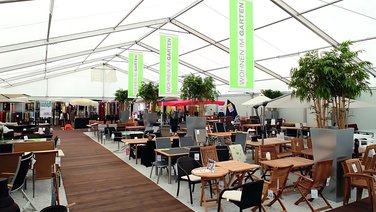 Interior view of a temporary sales area, large tent with trapezoidal sheet metal and PVC tarpaulin roof