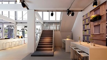 interior view of corporate event hall looking up at staircase