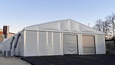 Front view M-Line with view of roller gates and staff door