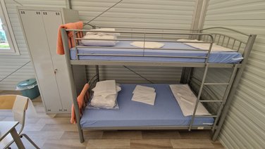 Interior fittings with lockers and bunk beds in a refugee centre
