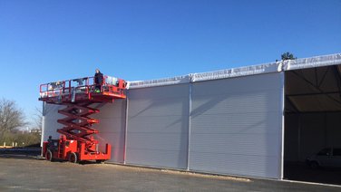 Side view of a warehouse with internal façade during construction