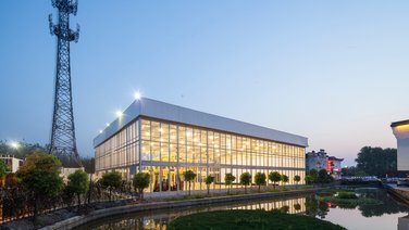 Side view of the Wuzhen Art Gallery illuminated at night