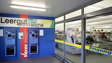 Anteroom for the return of empties, temporary retail sales area