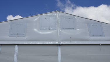 Front view of four smoke extraction flaps in the gable triangle
