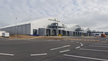 Rear of a sorting and freight centre with a view of truck docking stations