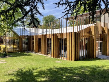 Elegant wooden curtain wall façade for a RÖDER tent