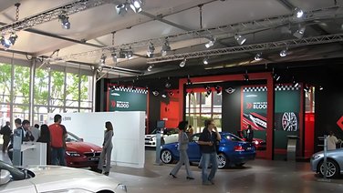 Interior view of a temporary car dealership showroom
