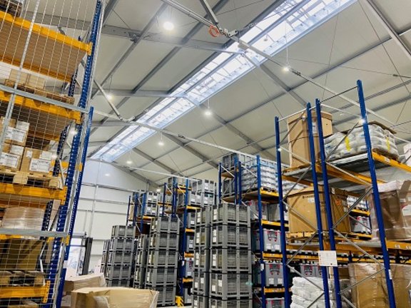 Interior view of a high-bay warehouse built by RÖDER with fixed roof covering