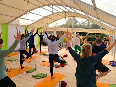 Elegant bodega tent with semi-transparent roof tarpaulin - used as a yoga room