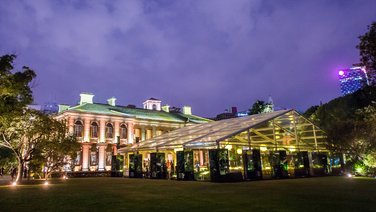 Exterior view of a large tent with a view of the transparent gable triangle