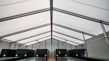 Interior view of a golf club warehouse with caddy spins