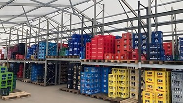 Interior view of a storage tent with pallet racks