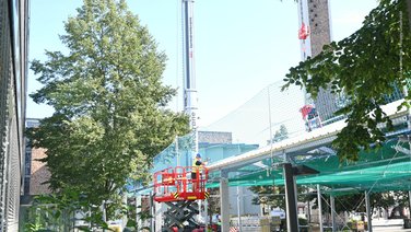 Side view of a tent structure during assembly