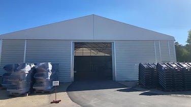 View of the front of a sliding gate on an industrial tent