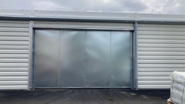 Tent hall with view of a sliding steel door
