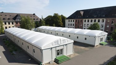 Bird's eye view of two lightweight halls as refugee accommodation