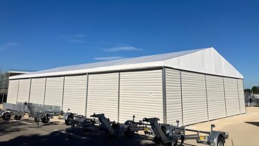 Side view of an industrial tent from the rear