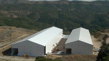 Bird's eye view of two waste storage tents with gable doors