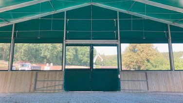 Interior view of an indoor riding arena at the entrance area