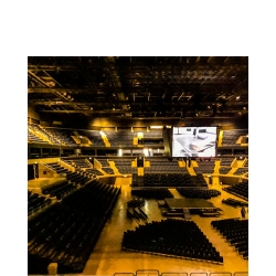 Interior of a stadium, many chairs for a concert