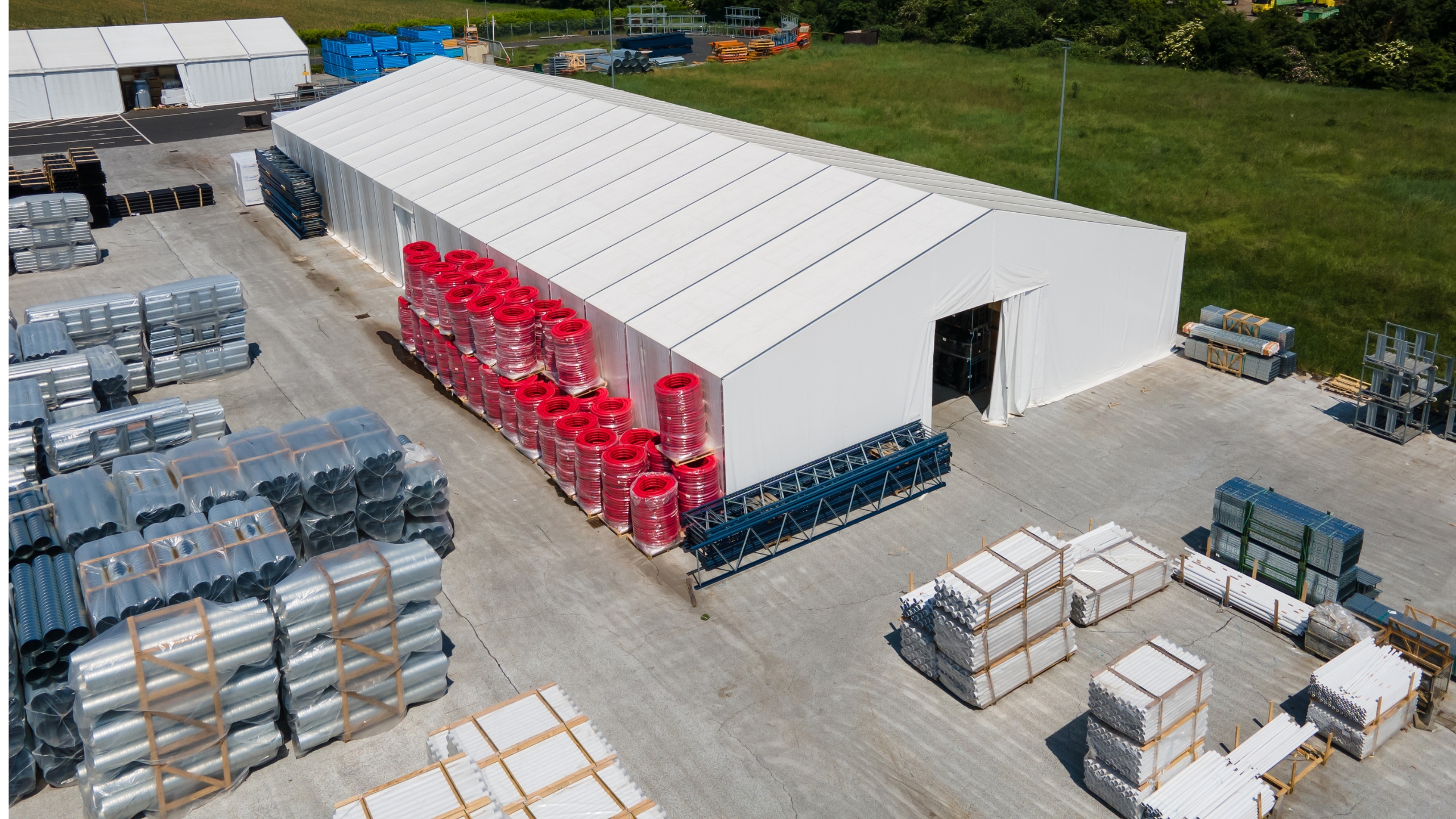 Front view of a warehouse with tarpaulin door, perspective from the side above