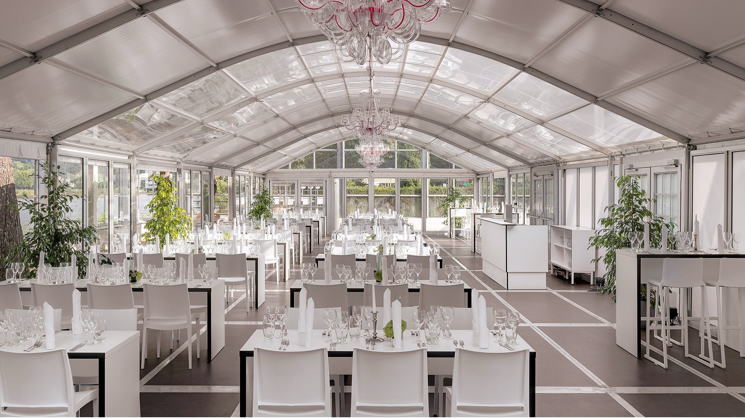 Interior view of a catering tent with stylish banquet seating Rheinhotel_Innenansicht.jpg
